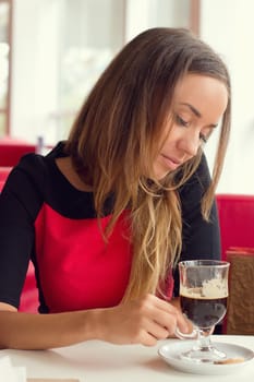 woman drinking coffee in the morning at restaurant