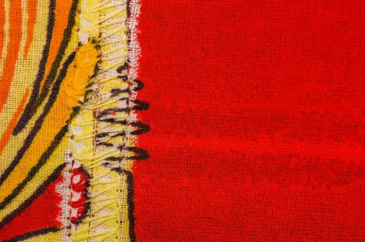 Sewn cloth background in orange yellow and red