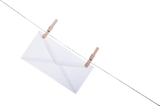 Envelope held by clothespins on a string