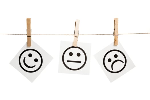 Expression messages held by clothespins on white background