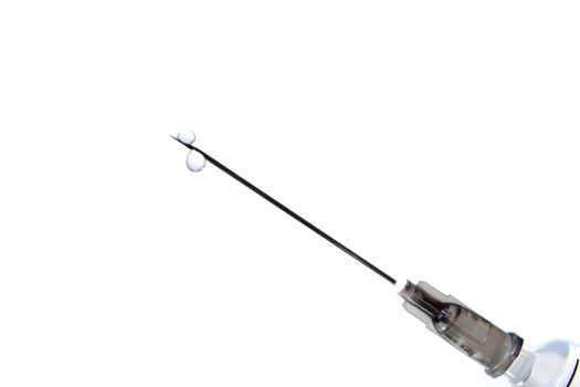 Syringe on white with needle