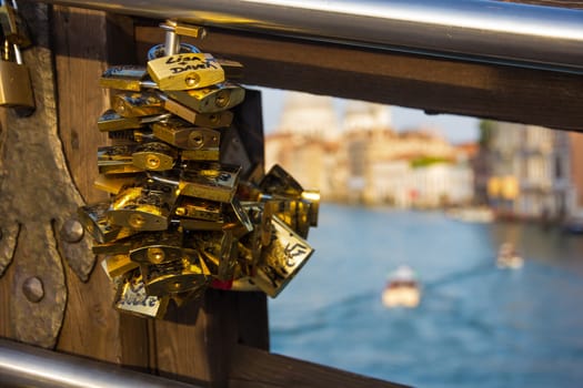 Picture of padlocks locked to a bridge in Venezia. Couples locked these as a sign of eternal love.