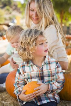 Adorable Young Family Enjoys a Day at the Pumpkin Patch.