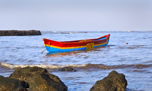 Horizontal early morning landscape of fishermans canoe moored on the coastline of the Arabian Sea at Manori, Bombay, India