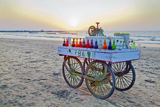 India slush ice street vendors cart hoping to do some trade before the end of a day on the beach at Manori, Bombay, India