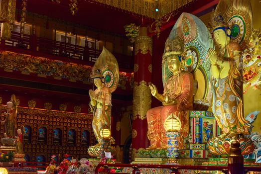 Buddha in Tooth Relic Temple interior in China Town, Singapore