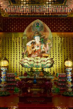 Buddha in Tooth Relic Temple interior in China Town, Singapore 