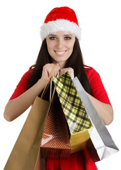 Young woman in Christmas costume on white background.