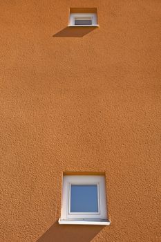 Windows on a Terracotta Wall