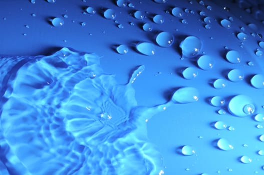 Some Water Drops on a Blue Textured Background