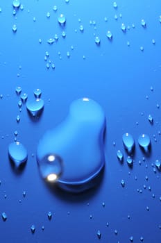 Some Water Drops on a Blue Textured Background