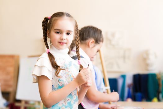 portrait of a girl in an apron, the kids involved in art school