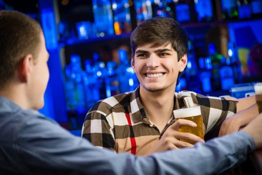 portrait of a young man at the bar, fun nightlife