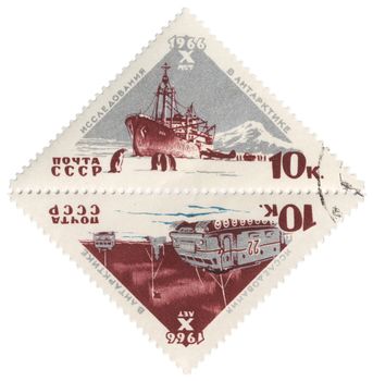 USSR - CIRCA 1966: A post stamp printed in USSR shows research vessel and all-terrain vehicle, dedicated to the 10th anniversary of Soviet research in Antarctica, circa 1966