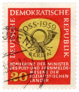 GDR - CIRCA 1959: A stamp printed in GDR (East Germany) shows emblem with post horn, circa 1959