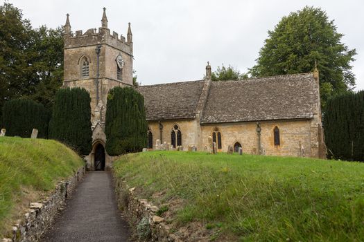 St Peters parish church in Upper Slaughter in Cotswold or Cotswolds district of southern England in the autumn.