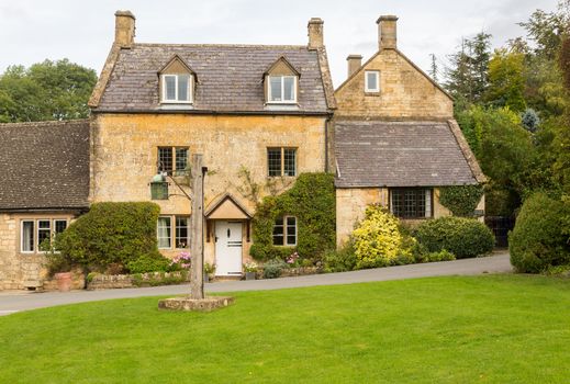 Village green in Stanton in Cotswold or Cotswolds district of southern England in the autumn.