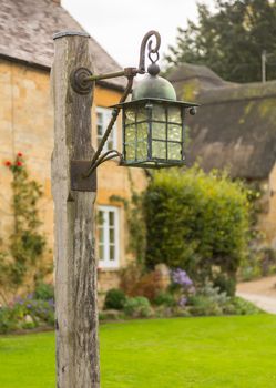 Street lamp in the village of Stanton near Stanway. Cotswold or Cotswolds district of southern England in the autumn.