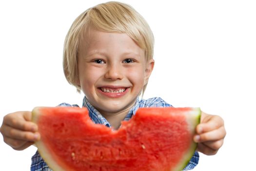 A close-up shot of a smiling cute boy holding out a nibbled water melon. Isolated on white.