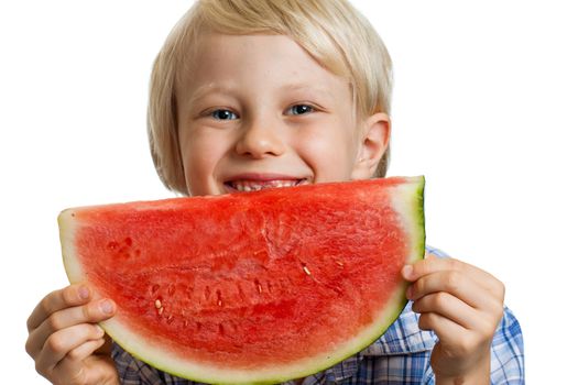 Close-up shot of a cute happy  boy smiling behind a juicy  slice of watermelon. Isolated on white.