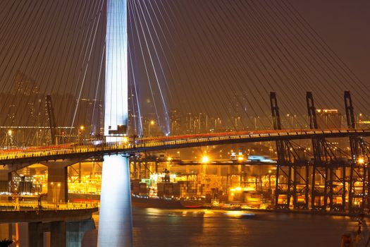 Freeway in night with cars light in modern city 