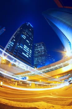 Colorful city night with lights of cars motion blurred in hong kong 