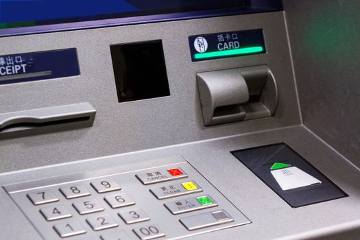 Close up of an ATM machine. Keyboard and insert card 
