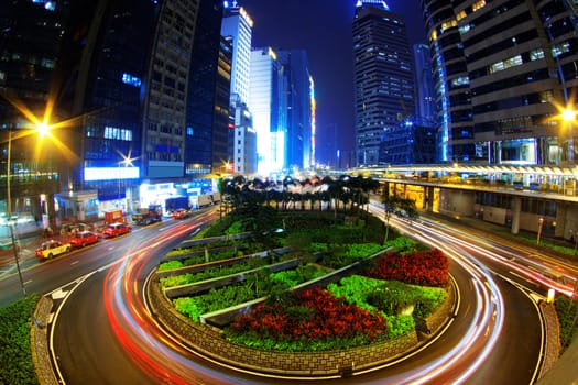 Colorful city night with lights of cars motion blurred in hong kong 