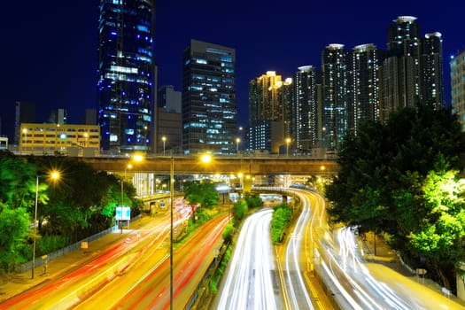 Downtown night, busy traffic light in hong kong 