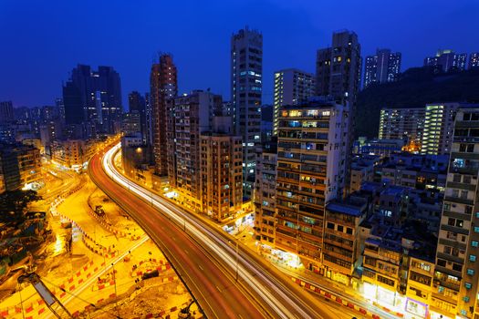 Colorful city night with lights of cars motion blurred in hong kong 