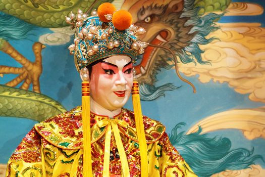 chinese opera dummy and red cloth as text space ,it is a toy,not real man 