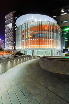 modern office building in downtown city at night