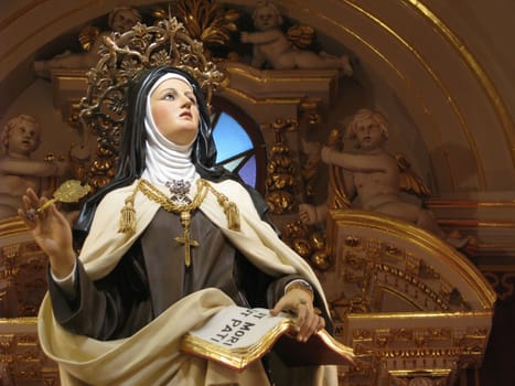 A detail of a statue of Saint Teresa of Avila in Cospicua, Malta.