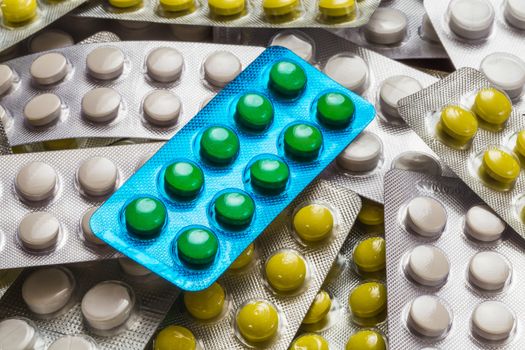 different colored pills in the pack closeup