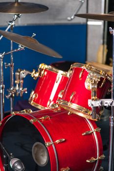 Red drum kit in recording studio