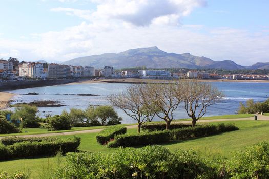 panorama of a coastal town by the sea with its beach and mountains