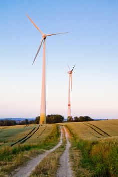 Windmills at dusk, an renewable energy source