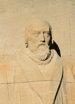 Close up of John Knox statue on reformation wall in Parc Des Bastions, Geneva, Switzerland.