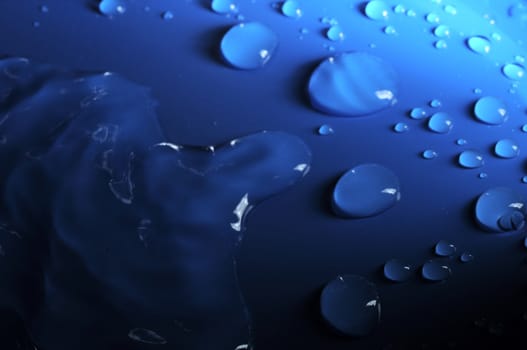 Some Water Drops on a Blue Textured Background