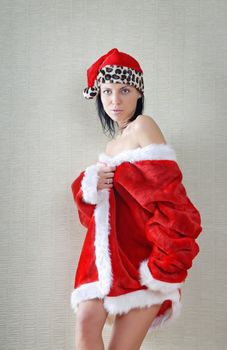 Glamour photo of the sexy lady in the red Santa costume