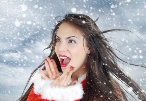 Happy screaming lady outdoors and falling snow