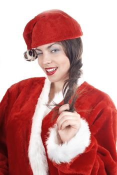 Woman in Santa Claus costume winking and laughing on a white background