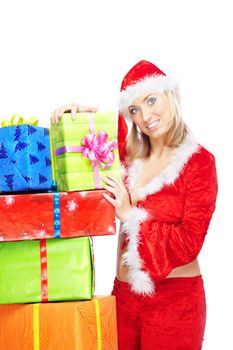 Smiling lady in Santa costume holding Christmas gifts on a white background