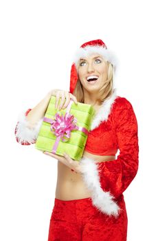 Happy lady in Santa Claus costume holding Christmas gift box on a white background