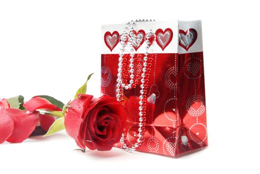 Close-up photo of the red rose and gift box
