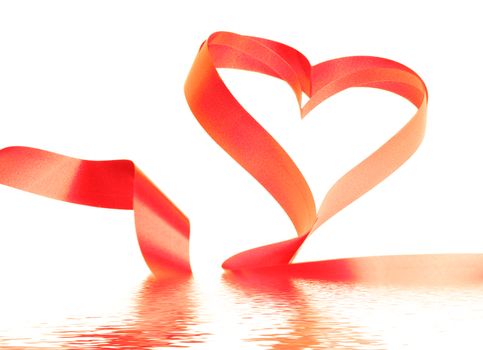 Close-up of the red ribbon heart flooded in water