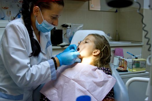 a girl at the dentist.