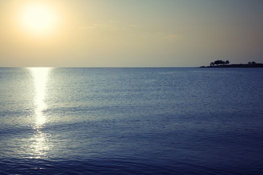 Evening sea during sunset. Horizontal photo with natural light darkness and colors