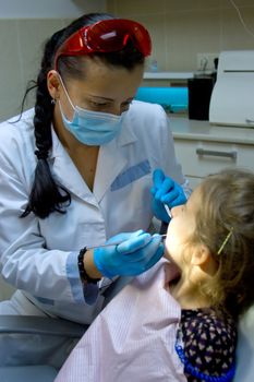 a girl at the dentist.