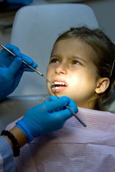 a girl at the dentist.